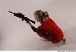 DENISA KNEELING POSE WITH GUN